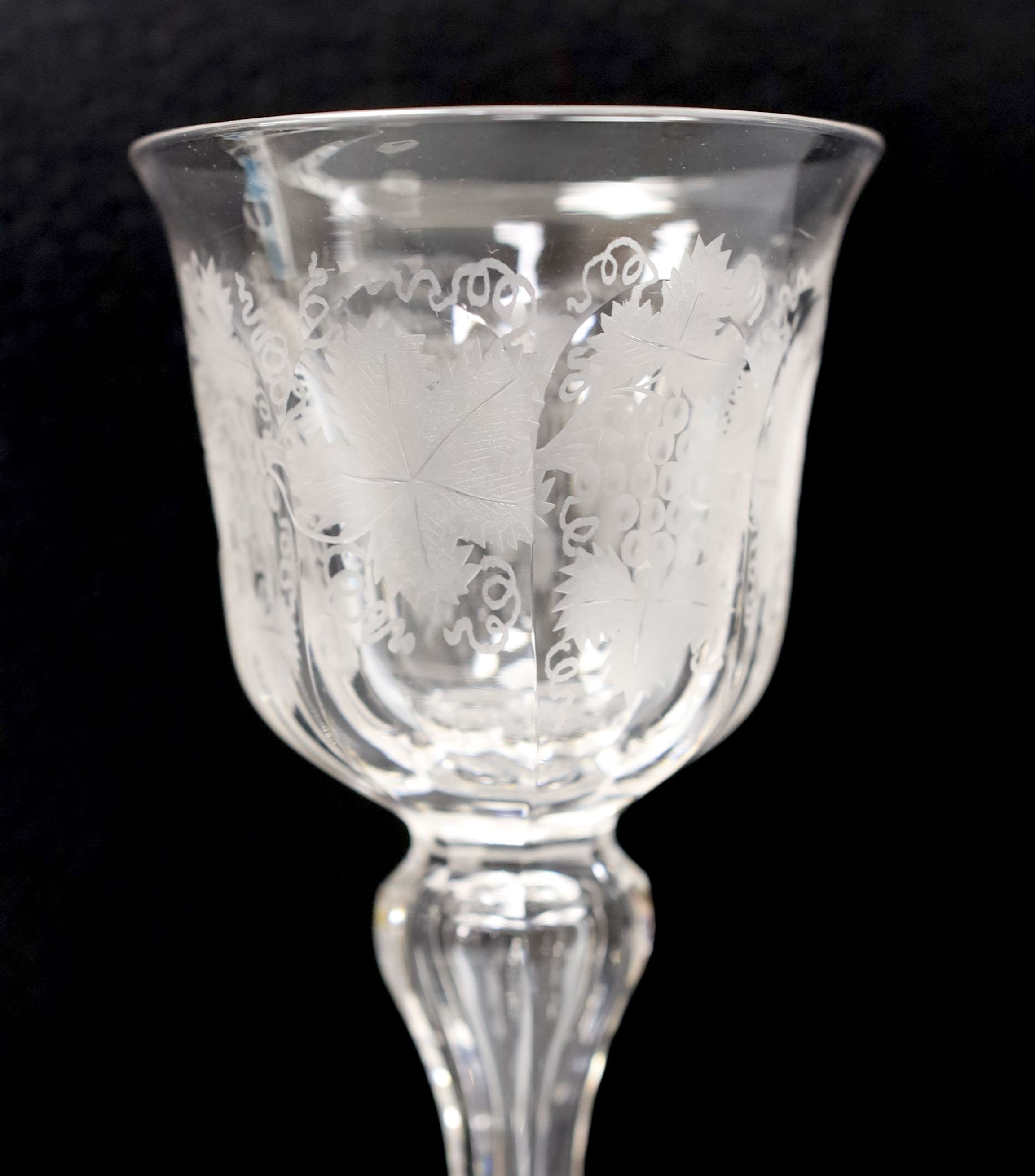 Two Bohemian wheel engraved amber flashed beakers, one with titled topographical views and a wheel engraved glass goblet (3) - tallest 18cm